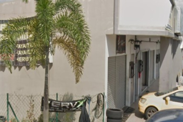 A PIECE OF COMMERCIAL LAND ERECTED THEREON A ONE STOREY OF SHOP OFFICE